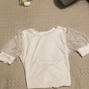 White shirt with polka dotted see-through sleeves
